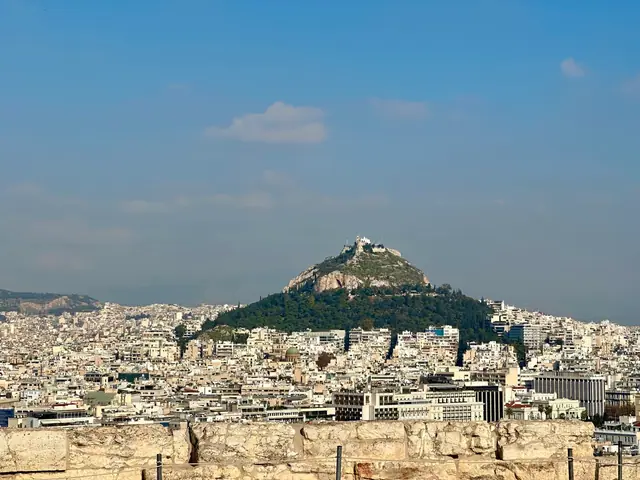 A view over the rooftops of Athens toward Mount Lycabettus