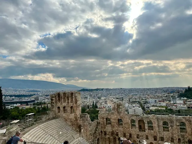 The ancient Odeon of Herodes Atticus below the Acropolis, under dramatic clouds