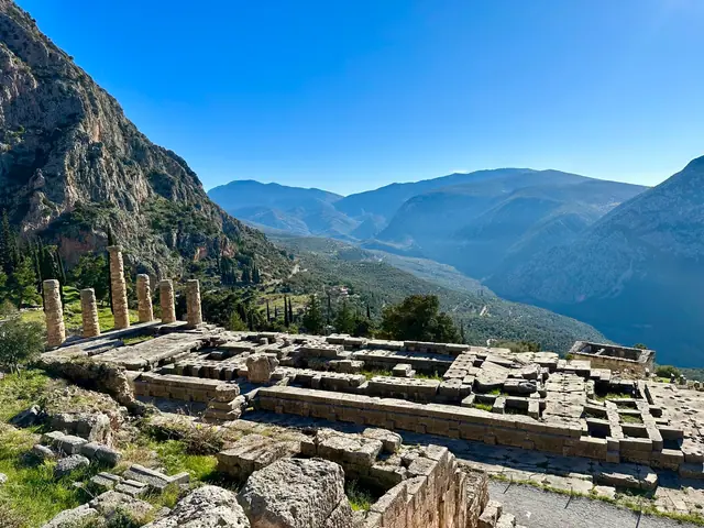 The Temple of Apollo at Delphi overlooking a valley of olive groves
