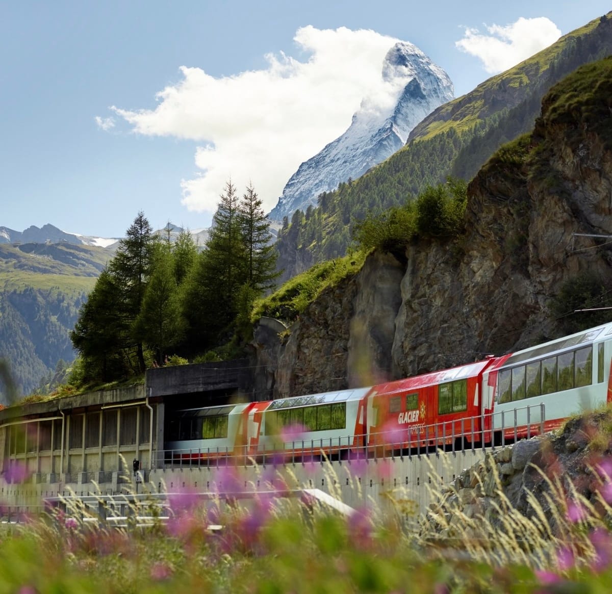 The Glacier Express passing by the Matterhorn in the Swiss Alps.